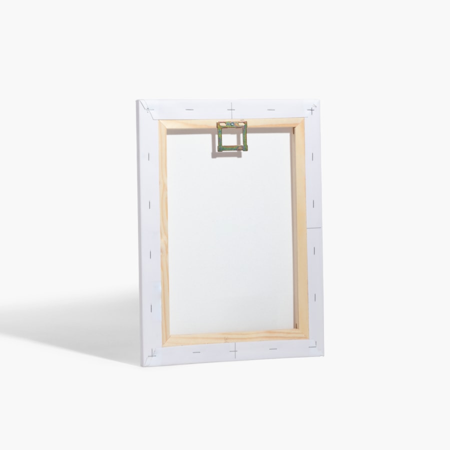 The back of a custom photo canvas, with attached hardware for hanging. 
