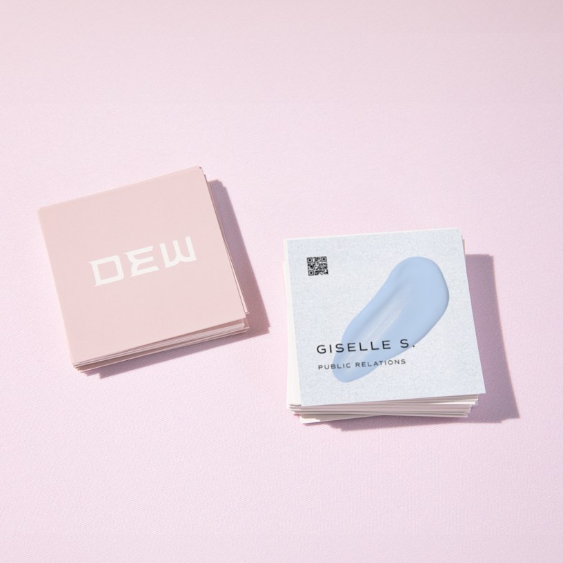 Front and back views of square business cards, designed for a public relations consultant.