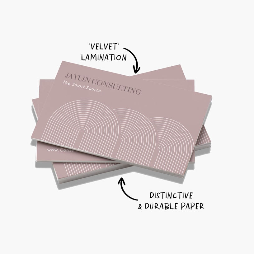 A stack of soft touch business cards for a consulting business with a note that they are made of distinctive, durable paper and also have a “velvet” lamination.