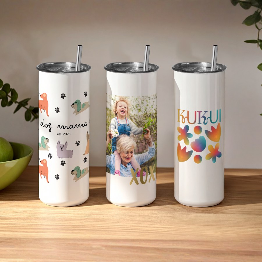 Three personalised tumblers printed with different designs: various dog icons, a family photo and a business name. 