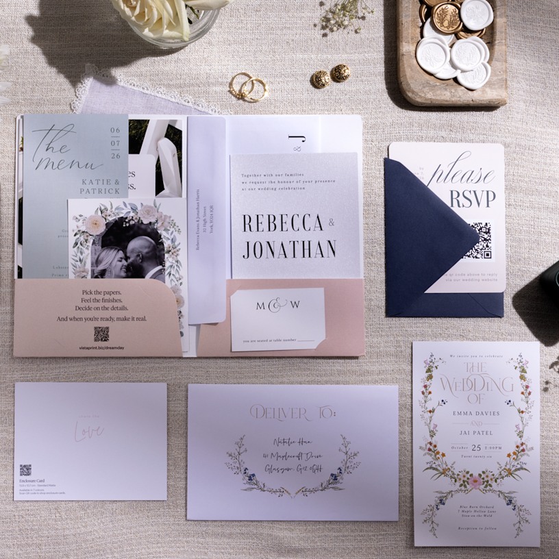 A spread of various wedding cards in different styles, including an invitation, save the date card, RSVP card and details card.