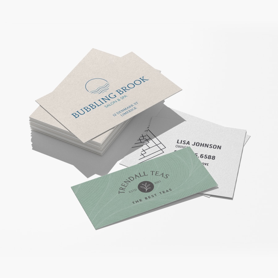 Three differently sized bamboo business cards, designed for three separate businesses.