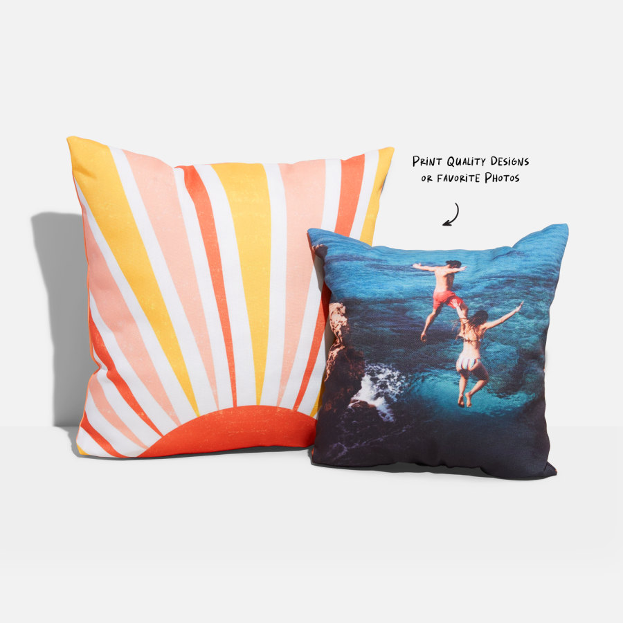 Printed cushions with bold designs one featuring a sunburst graphic the other a photo on pillow of friends cliff diving into blue water