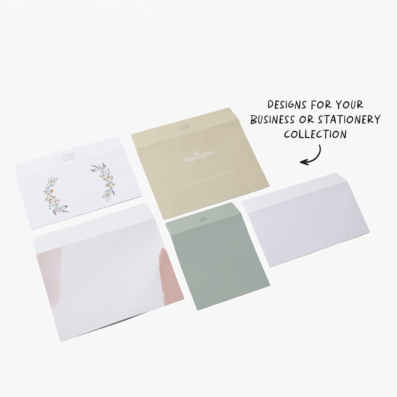 Custom envelopes printed in a variety of designs and colours, with a note that there are designs for your business or stationery collection available. 