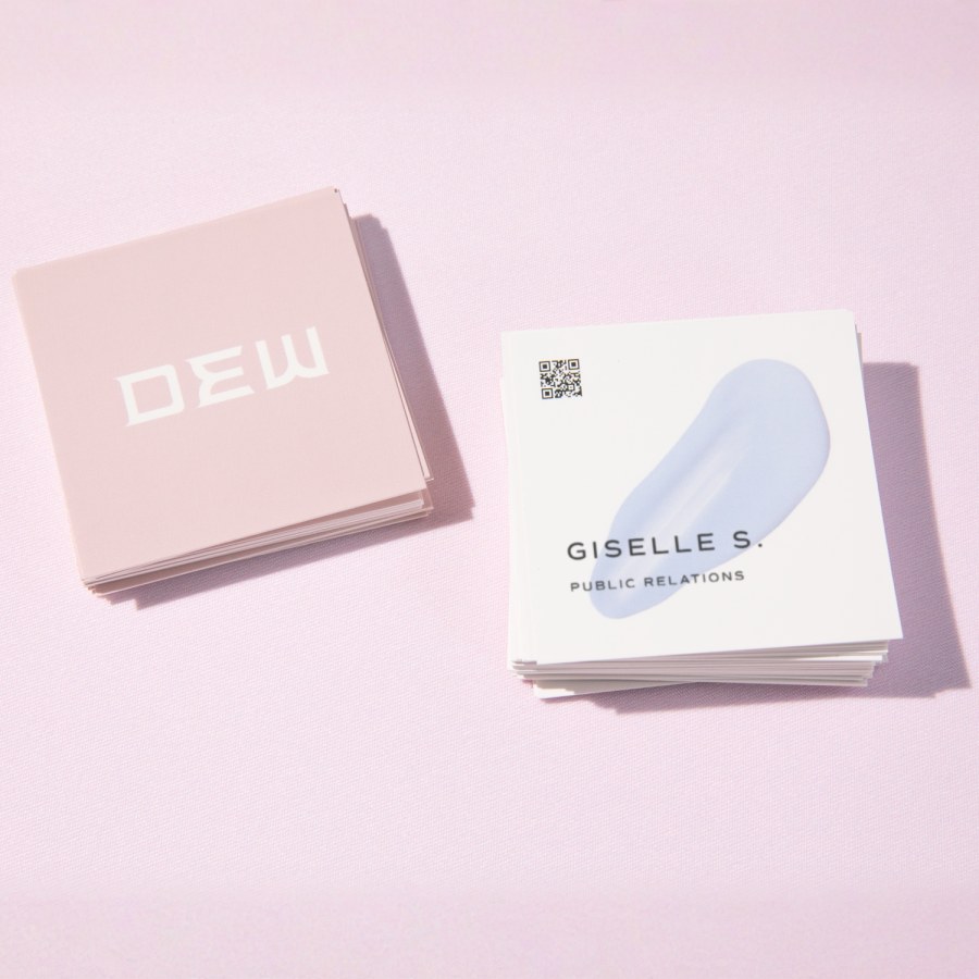 Front and back views of square business cards, designed for a public relations consultant.