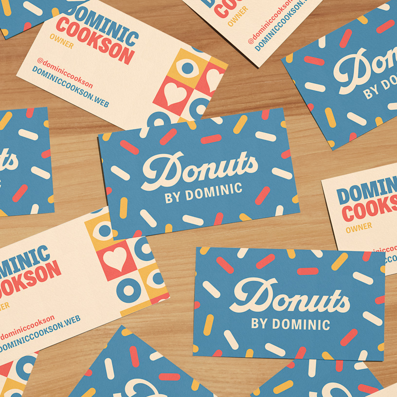 Designs for the front and back of several recycled matte business cards for a doughnut shop.