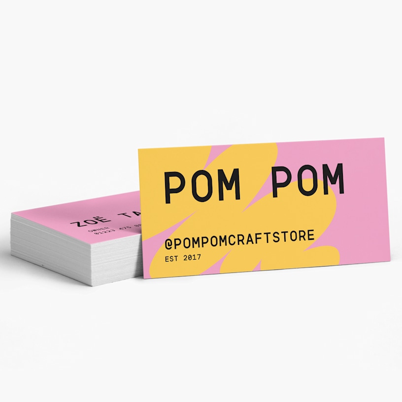 A stack of slim business cards for a craft shop.