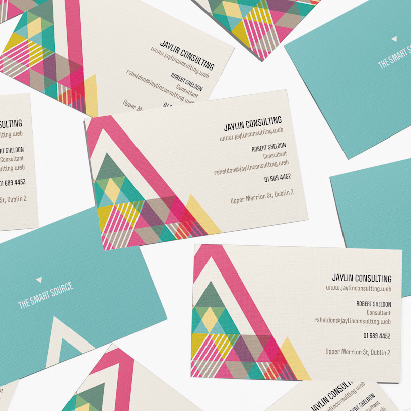 Designs for the front and back of multiple linen business cards for a consulting company.