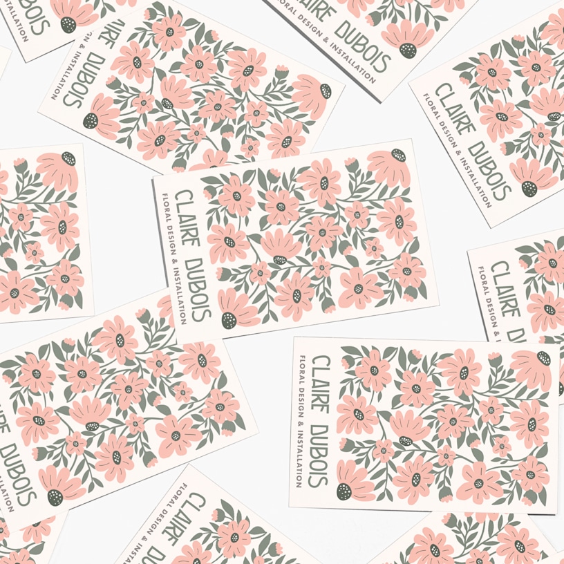 Multiple soft touch business cards for a person named Claire Dubois.