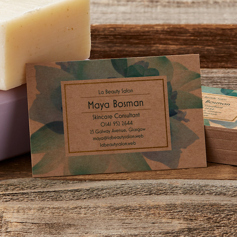 A standard-size kraft business card featuring a skincare business.
