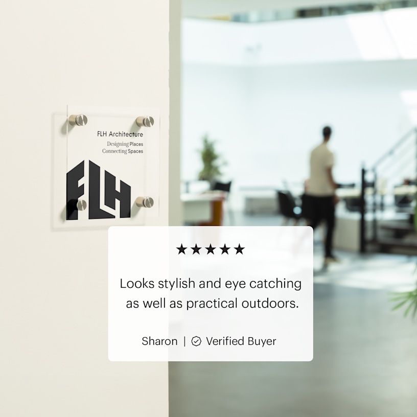 square acrylic sign with logo on a wooden door in an office