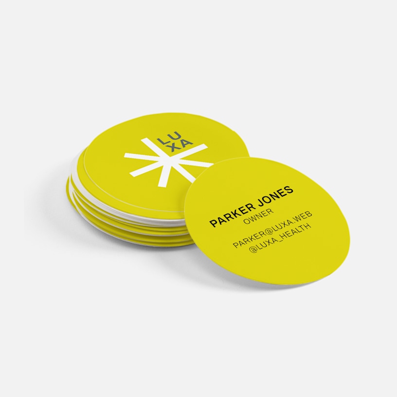 Minimalist circle business cards promoting a wellness business, with 2-sided printing.