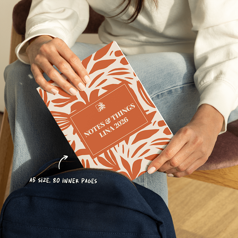 A person keeping their custom wraparound spiral notebook in a bag. An arrow points to its A5 size and 80 inner pages.