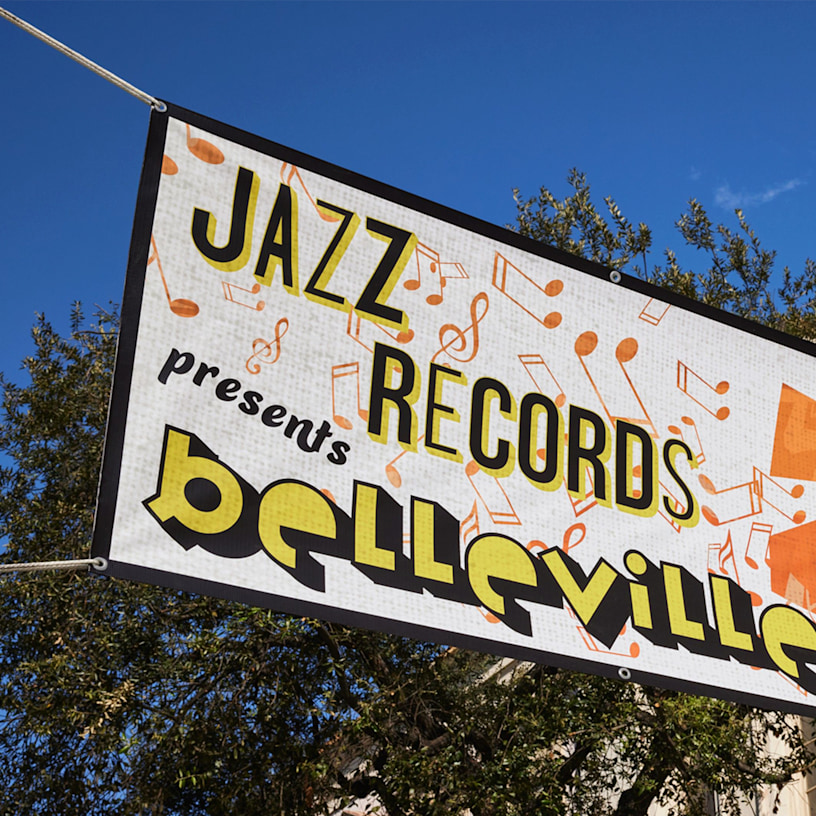 A horizontal mesh banner promoting a record store event.