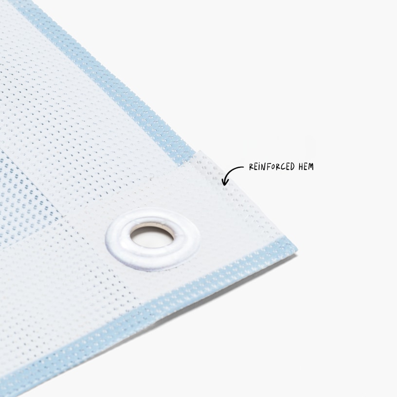 A closeup shot of the mesh banner's built-in grommets, designed for easier installation.