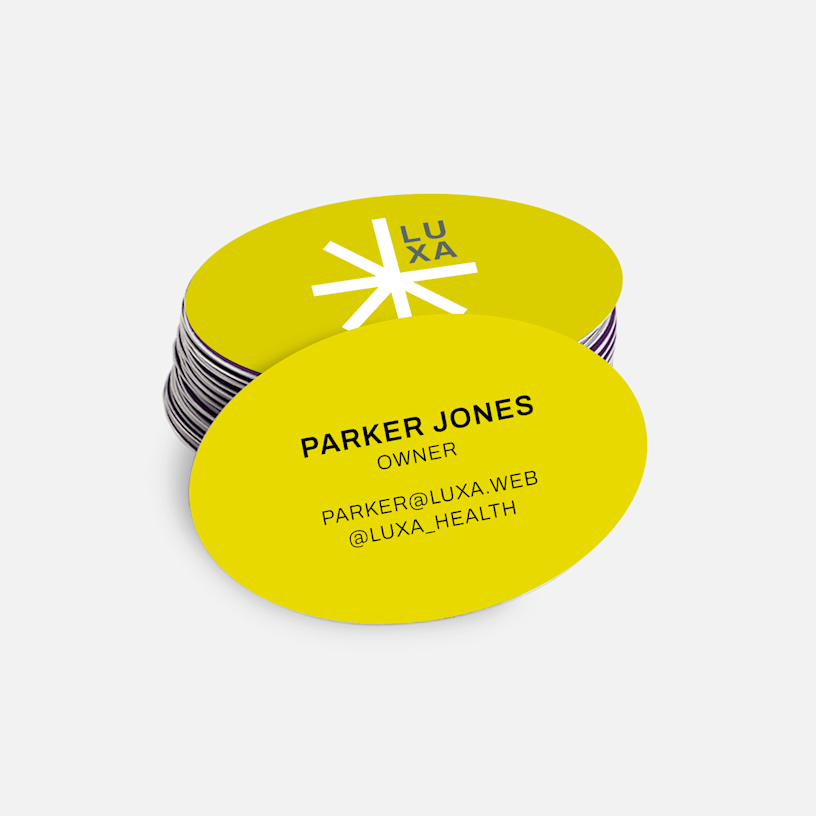 Minimalist oval business cards promoting a wellness business, with 2-sided printing.