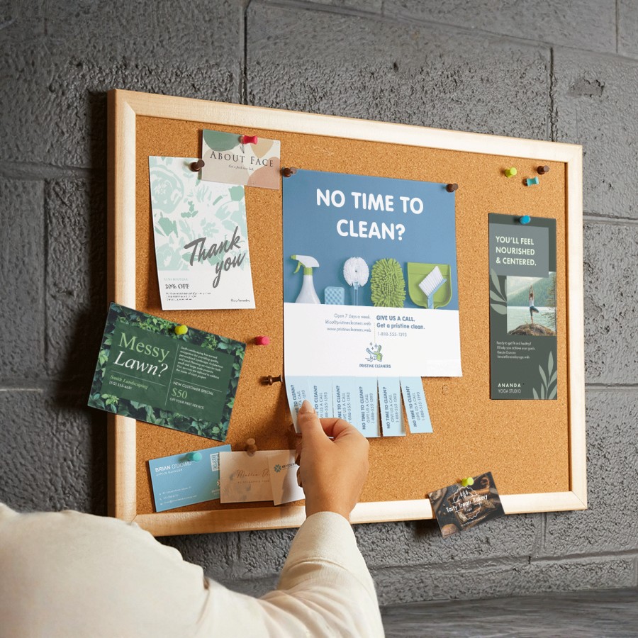 A perforated flyer on a corkboard has multiple tabs missing as people take them to use later.