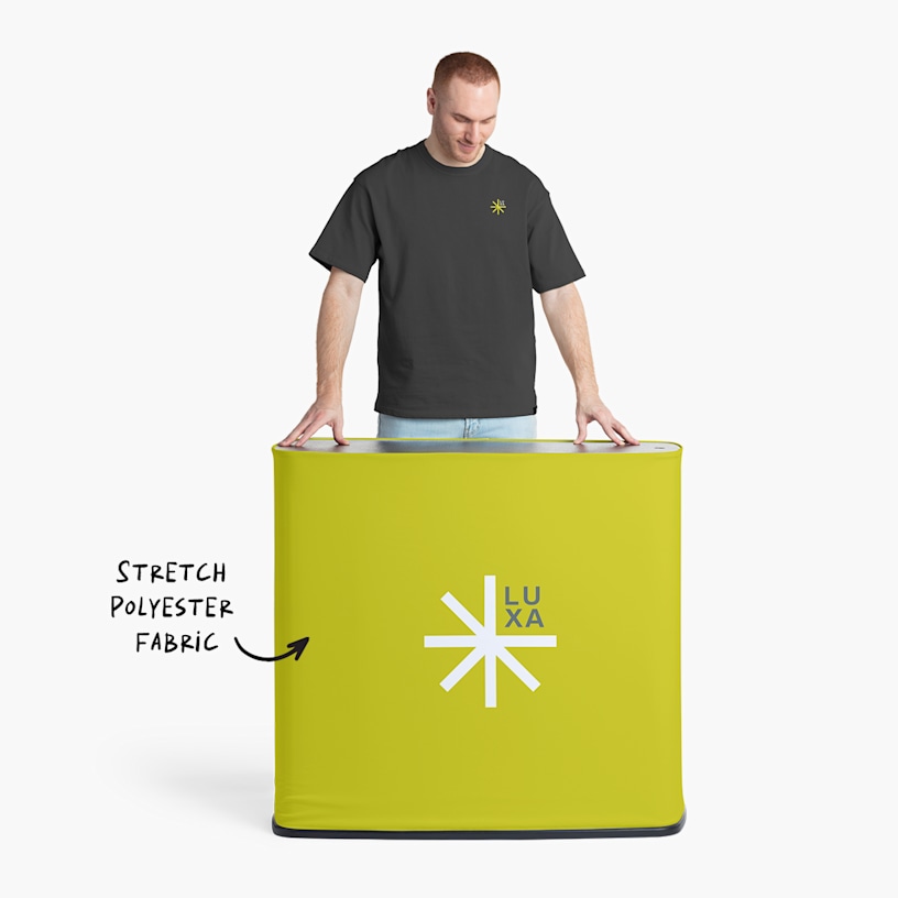  A man standing behind a case-to-podium kit for scale.