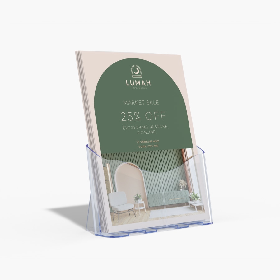 Flyers for a home goods store in a large flyer holder.