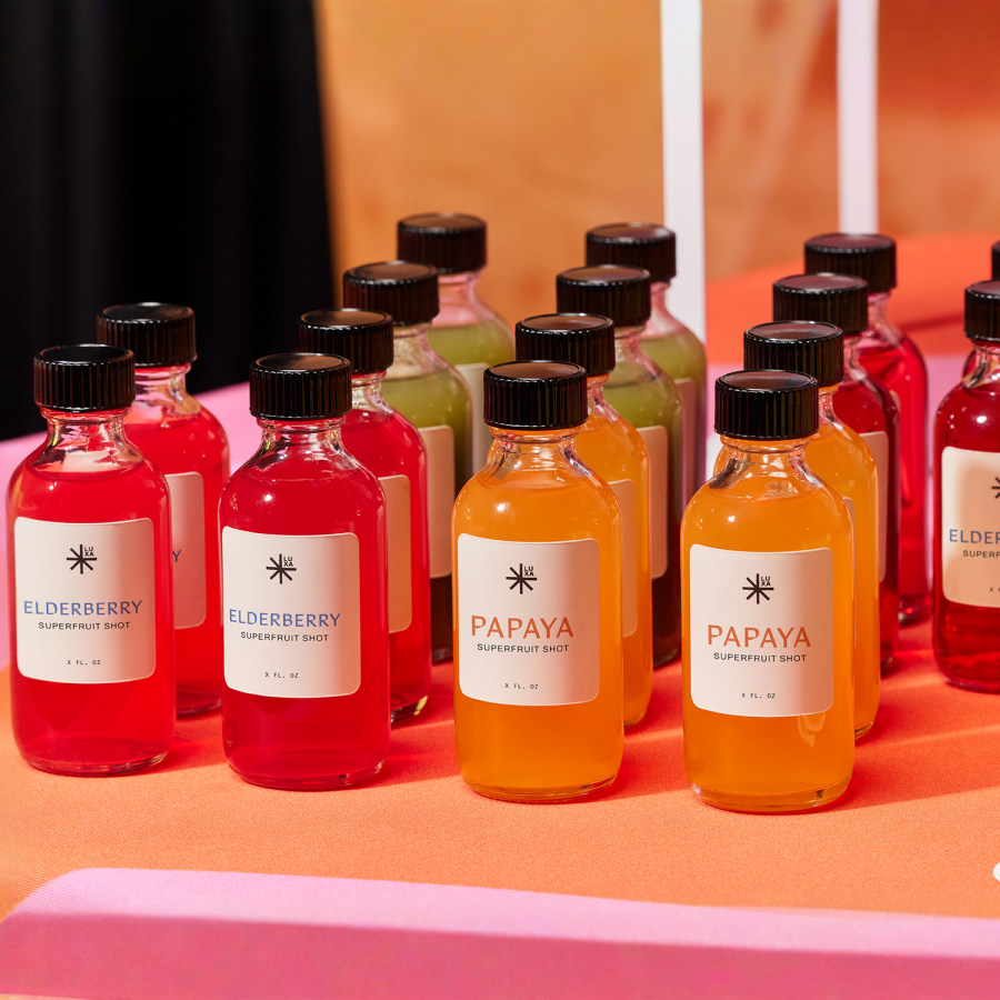 Assorted drinks with packaging labels showing the product name and company logo.