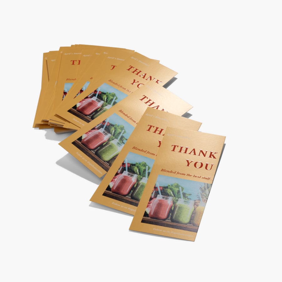 A stack of embossed gloss rack cards, promoting a juice or smoothie business.