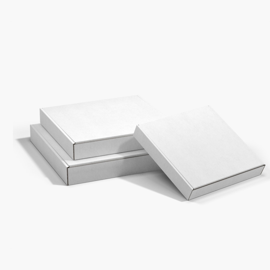  2 plain square mailer boxes stacked on top of each other and one leaning up against them.