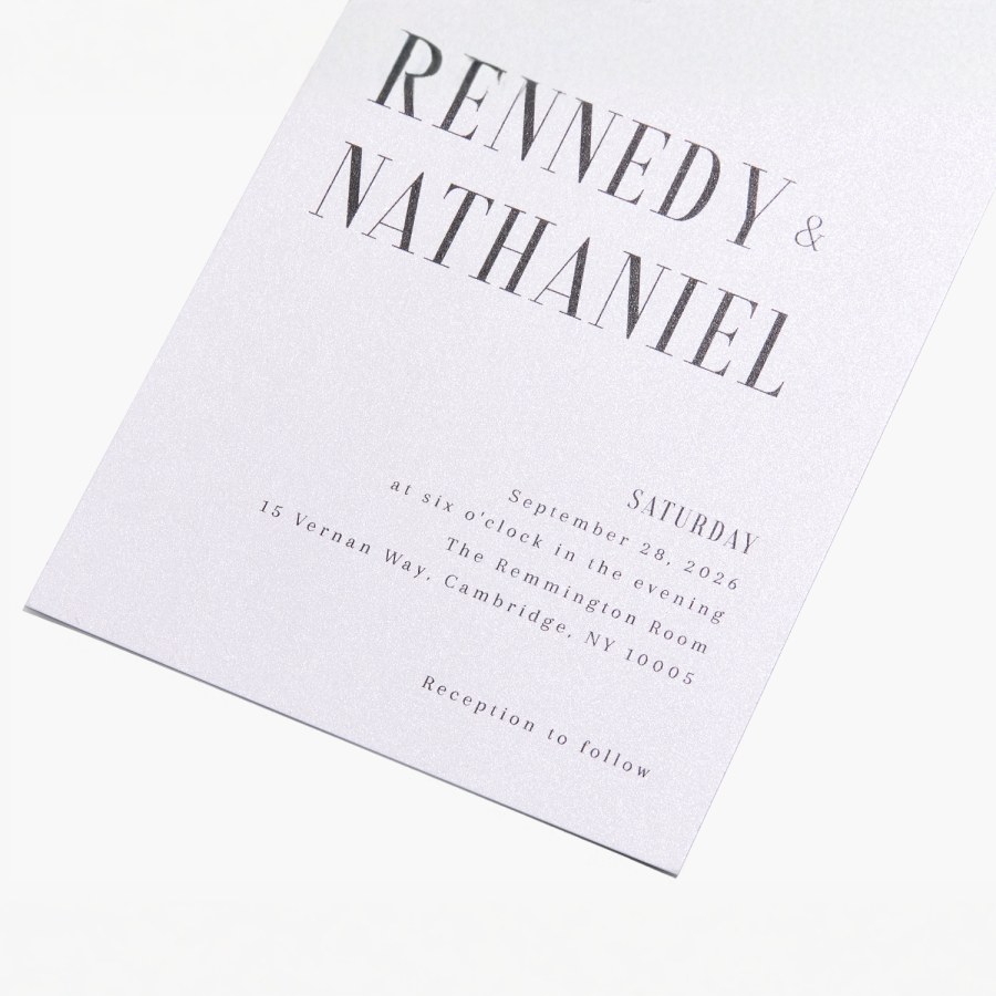 A custom wedding invitation personalized with a bold font style and pearl-finish paper stock. 
