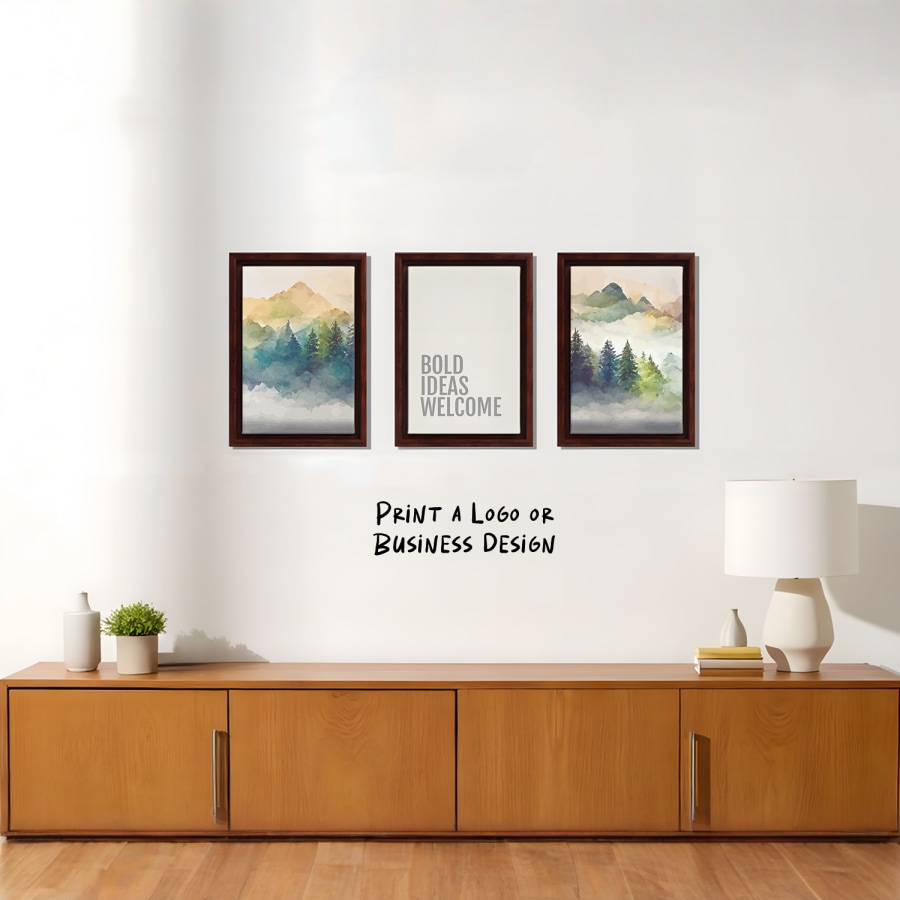 A trio of framed canvas prints hanging on a living room wall; one features the phrase, ‘Bold ideas welcome.’ 