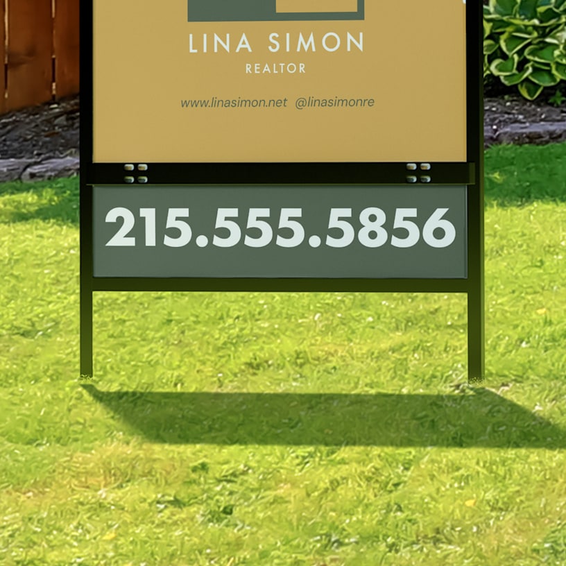 A close up of a bottom rider featuring a phone number. 