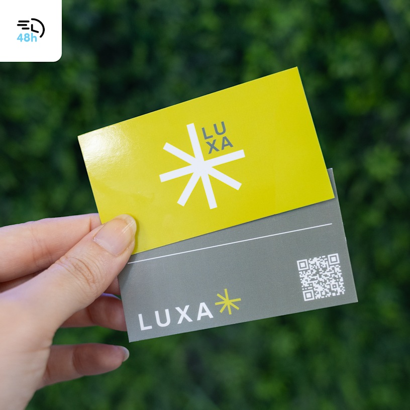 A hand holding yellow and gray business cards for a health supplements brand, displayed against green foliage, with a 48-hour delivery icon in the corner.