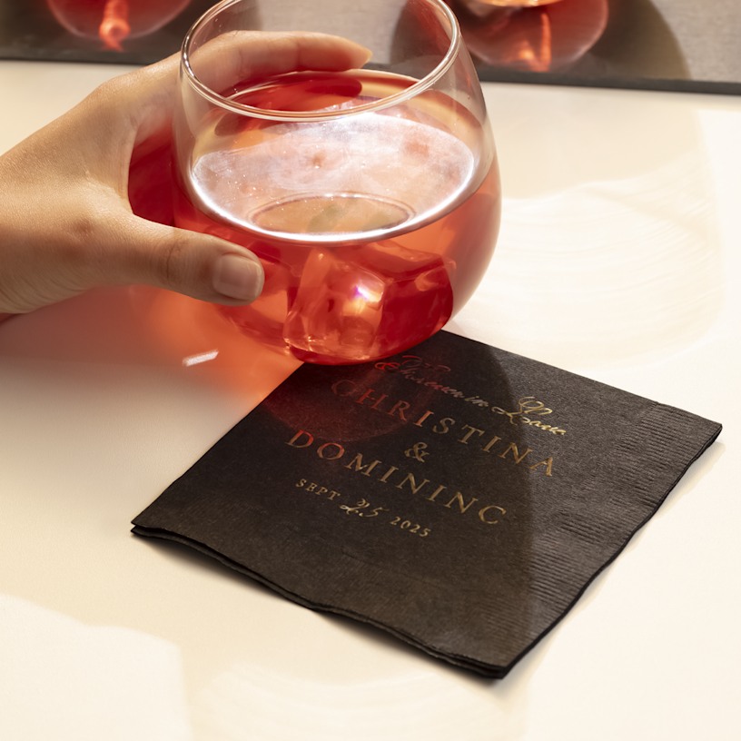 A custom foil napkin for a wedding printed with gold foil. 
