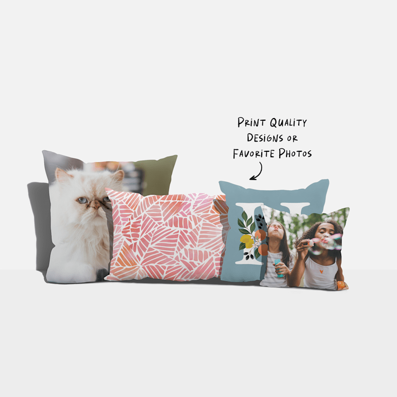 Four custom pillows in a variety of sizes and styles, with a note that says you can print designs or photos. 