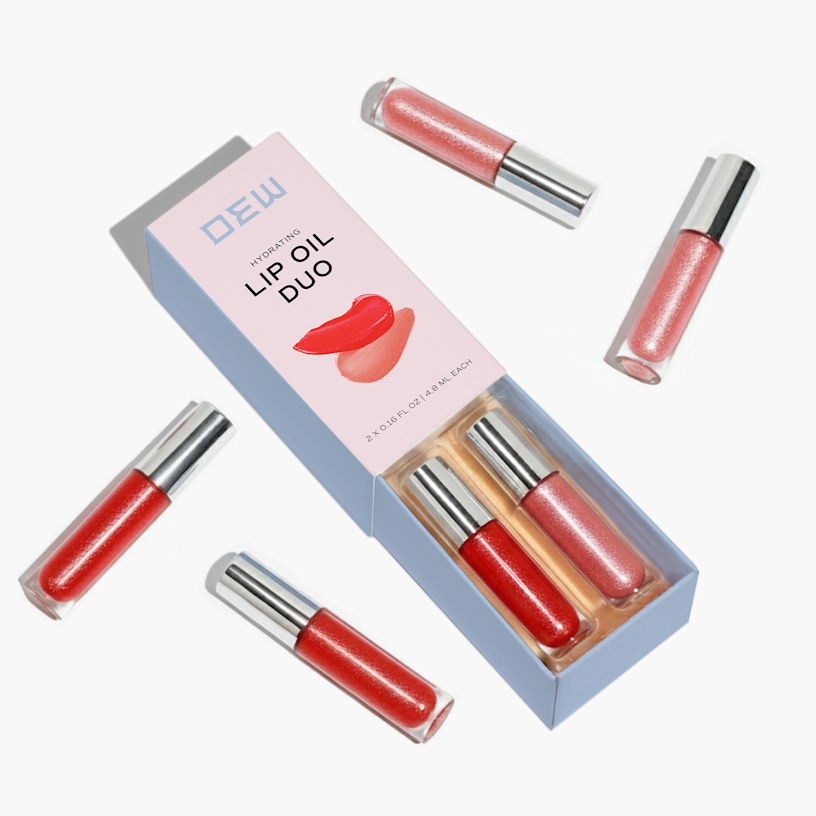 Slide-open box with 2 lipsticks inside. The box has 4 more lipsticks scattered around the box.