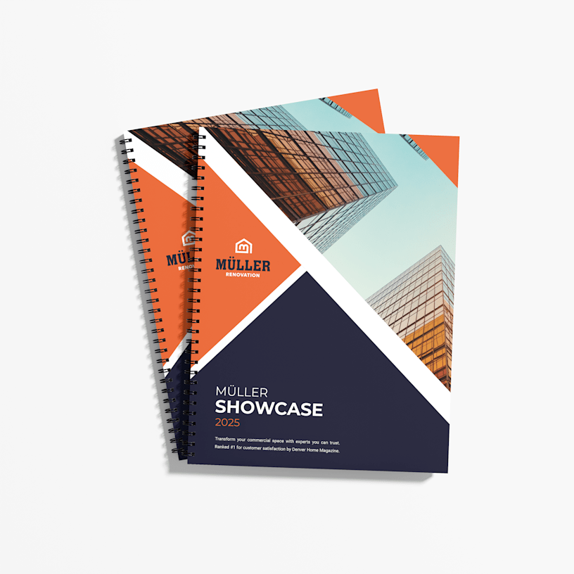 Two wire-bound booklets for a renovation company showcase against a white background.