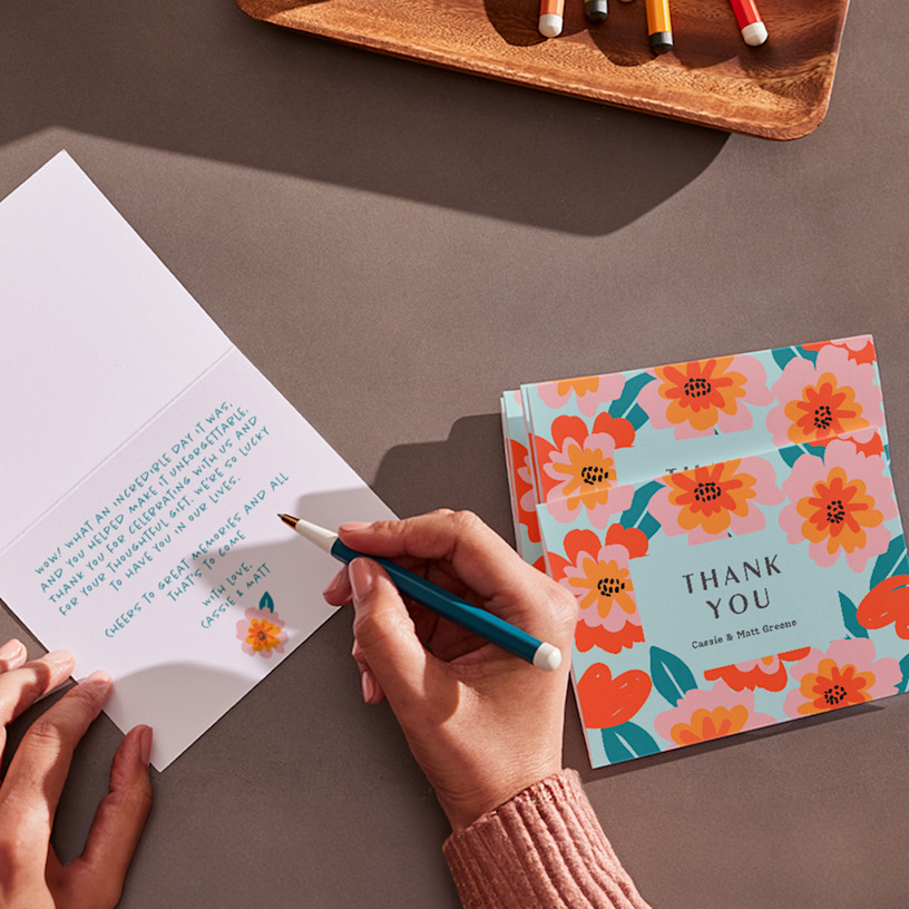 A thank you card with citrus graphics and a handwritten note. 