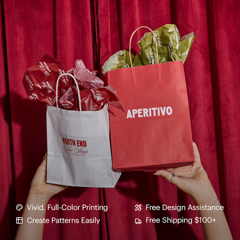 A pair of hands holding up two paper bags filled with tissue paper customized for an Italian restaurant. Highlighted benefits include full-color printing, free design assistance, free shipping and the ability to create your own tissue paper pattern.