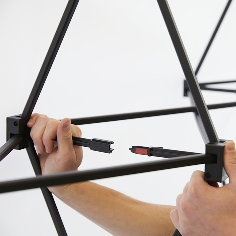 An up close of .locking the clips of the pop-up display together,