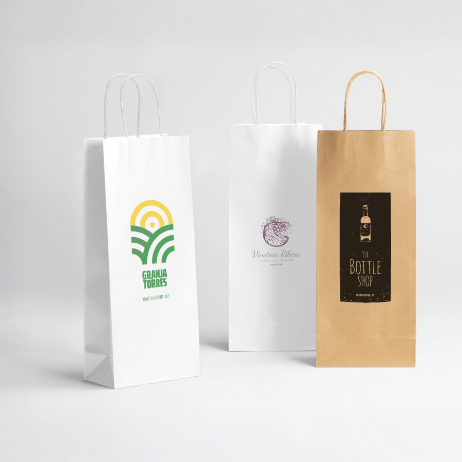 Two white wine bags and a brown wine bag all display their custom logos.