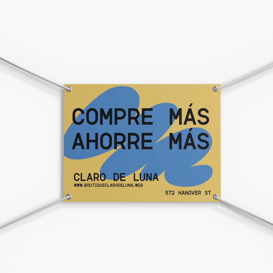 Un cartel para exteriores de una boutique de ropa se muestra colgado usando arandelas y cuerda.