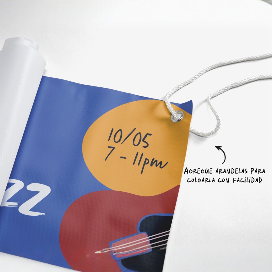 Una lona colgada con arandelas y cuerda, y con texto indicando “Agregue arandelas para colgarla fácilmente”.