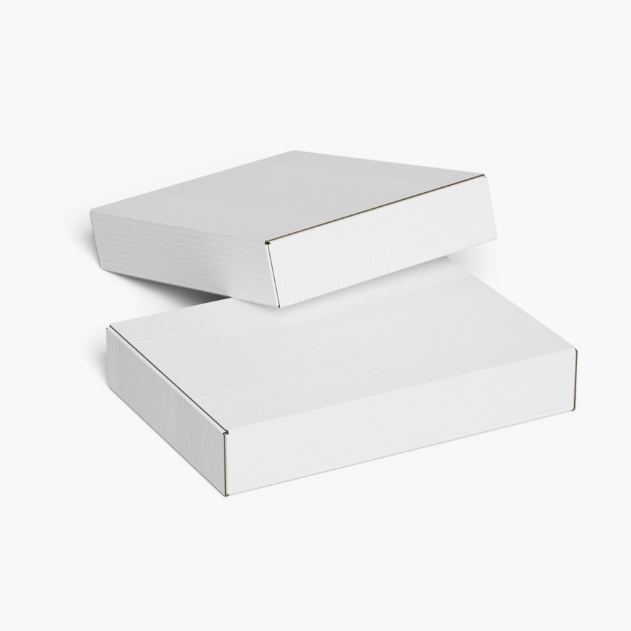 2 cajas planas para envíos sin impresión colocadas una sobre la otra.