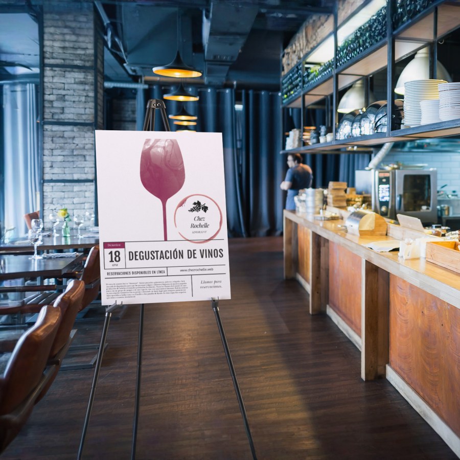 Un cartel de cartón pluma colocado en un caballete adentro de un restaurante.