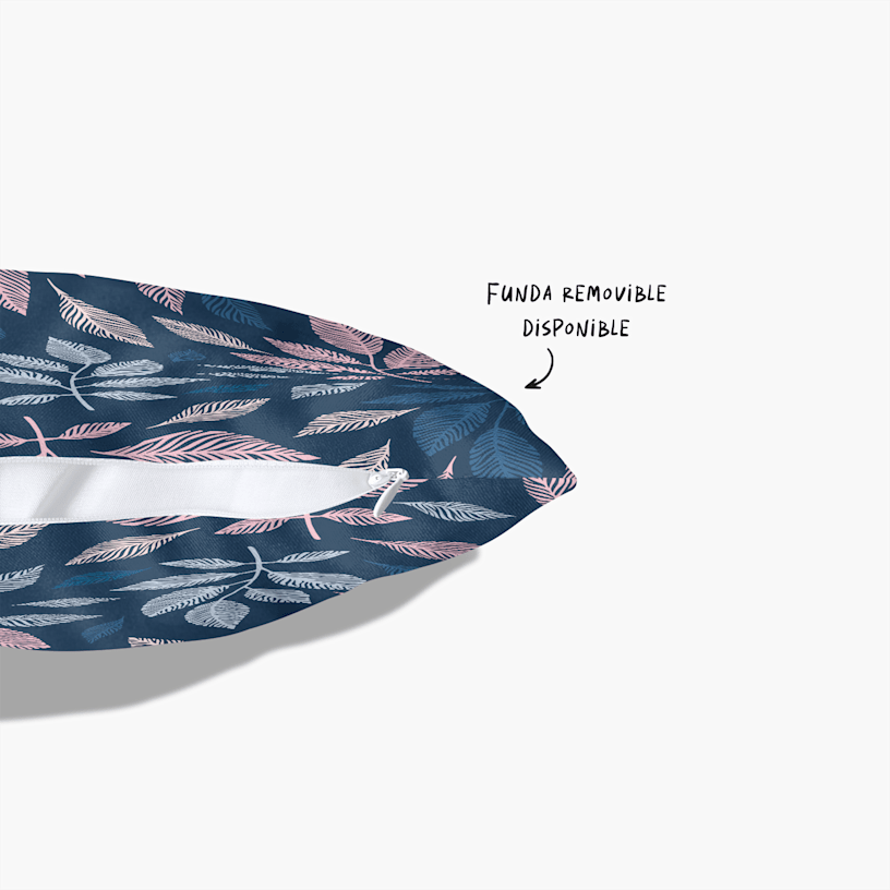 Una almohada con estampado personalizado y funda con cremallera parcialmente abierta, con una nota que indica que hay una funda removible disponible. 