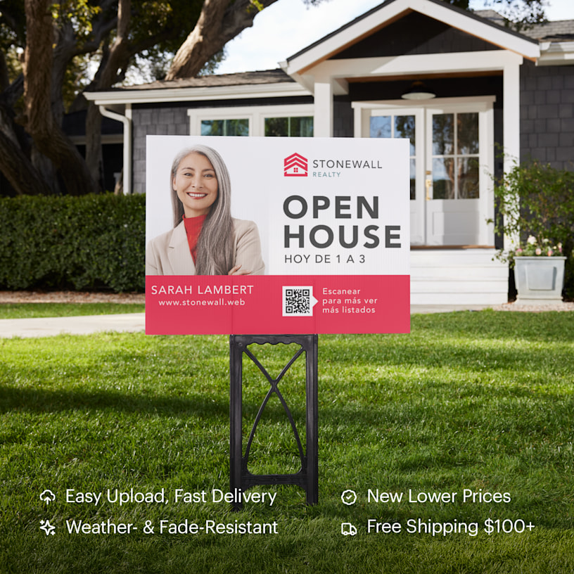 A yard sign in front of a home promoting an open house. Highlighted benefits include new lower prices, weather & fade resistant material, easy upload and fast, free shipping.