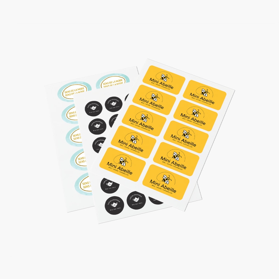 Une feuille d’autocollants rectangulaires, une feuille d’autocollants ronds et une feuille d’autocollants ovales, provenant de différentes entreprises.