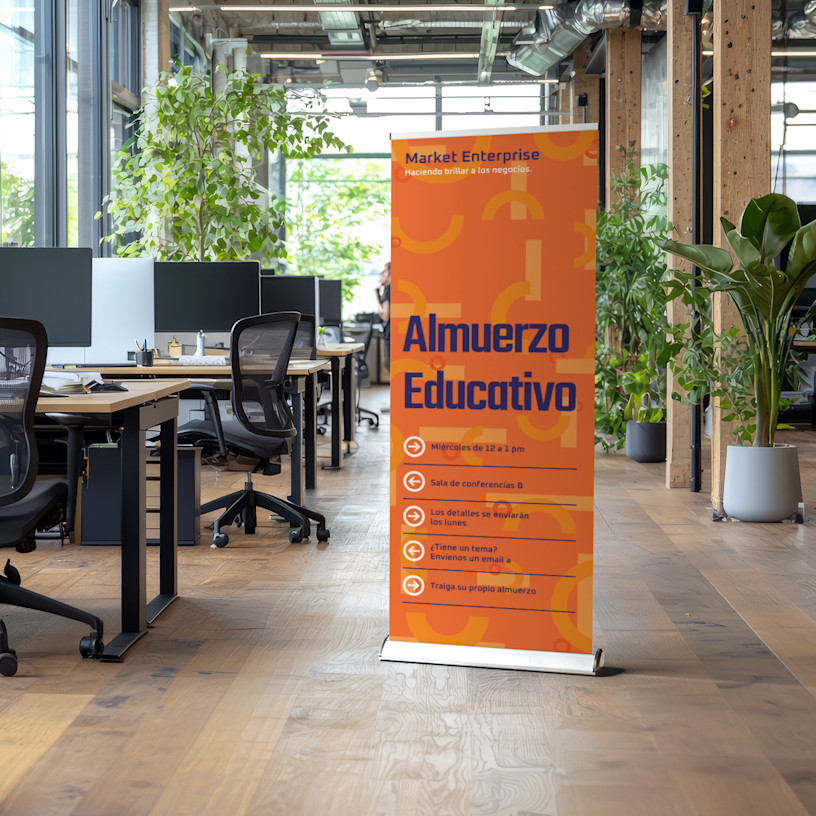 Une banderole rétractable annonçant un dîner-atelier dans un environnement de bureau.