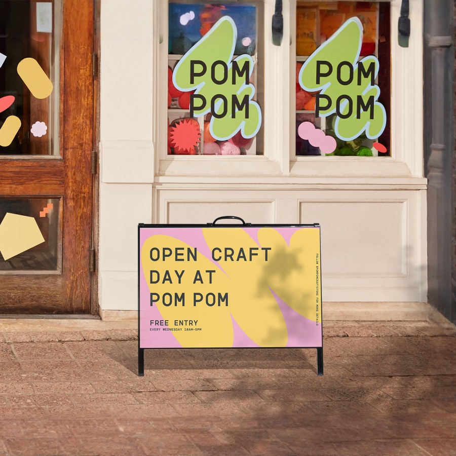 An A-frame promoting a craft store, displayed outdoors.