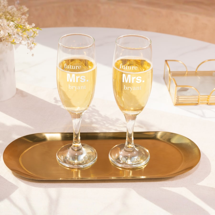 Champagne flutes for a bridal shower personalised with the text, "Future Mrs. Bryant".