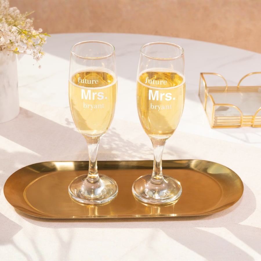 Champagne flutes for a bridal shower personalised with the text, "Future Mrs. Bryant".