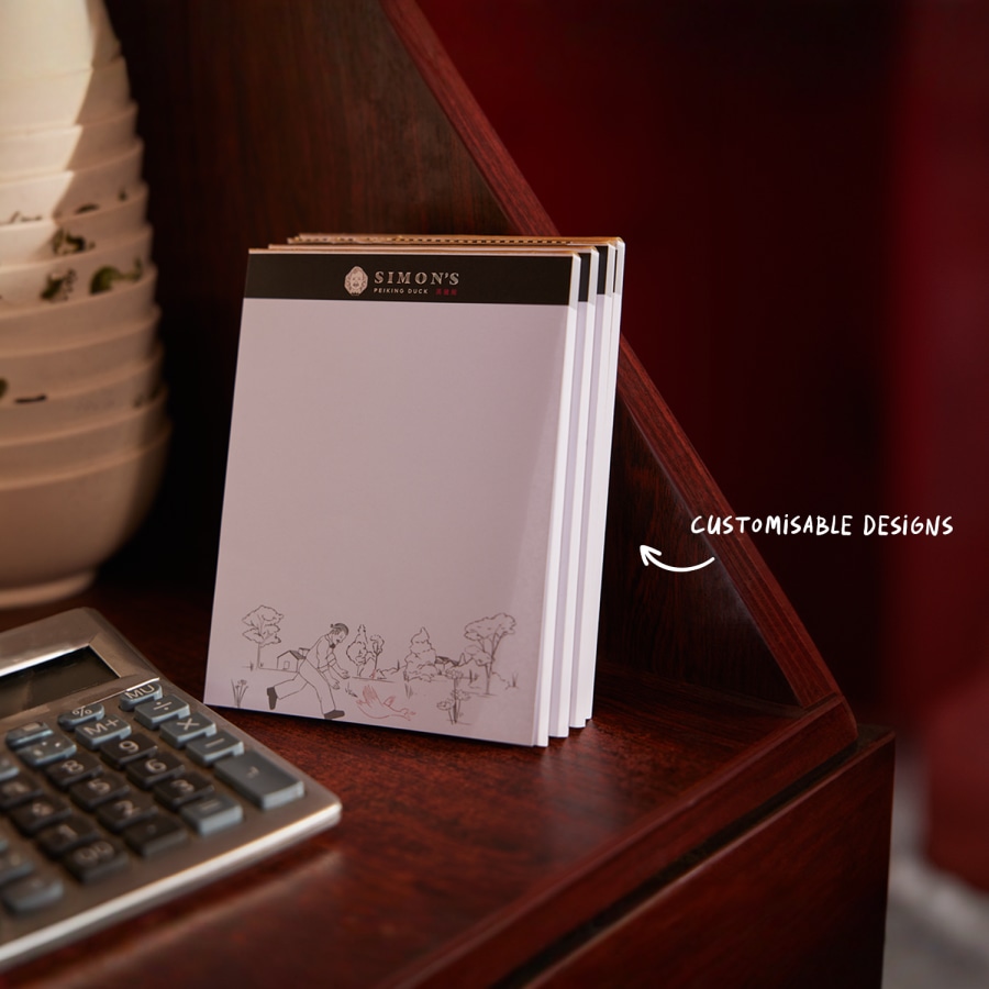 Branded notepads promoting a restaurant.